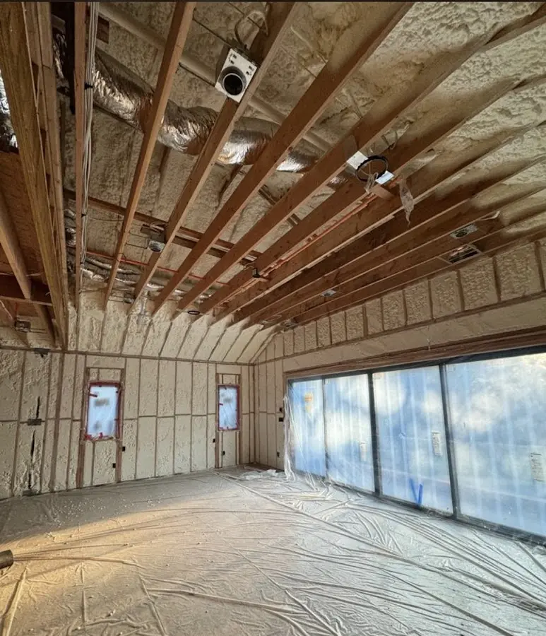 Interior walls and ceiling insulated with spray foam during new construction in Spring Valley Lake